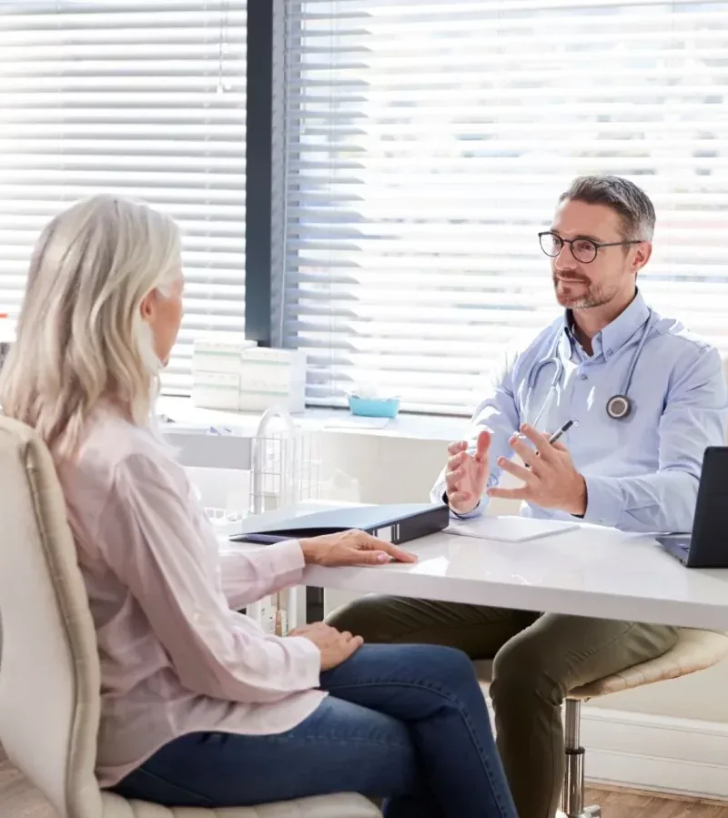 A mature patient in consultation with her doctor