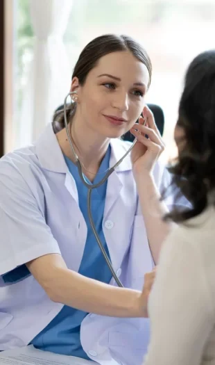 A doctor checking a patient at the clinic