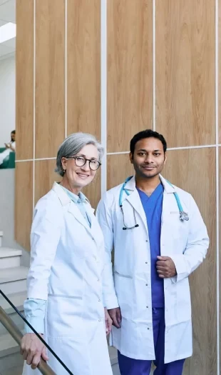 Two doctors on the stairs at the clinic